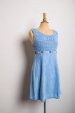1990's Denim baby doll sleeveless mini dress with a smock bodice and daisy appliques