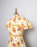1970's Yellow floral mini dress with attached layered capelet