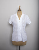 1980's White eyelet short sleeve button down shirt with embroidered florals.