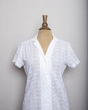 1980's White eyelet short sleeve button down shirt with embroidered florals.