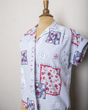 1980-90's Sky Blue short sleeve button down shirt with a floral red, blue and white quilt patchwork print