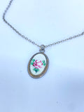 Silver necklace with small rose pendant