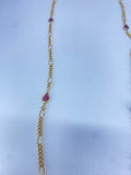 Long gold necklace with purple