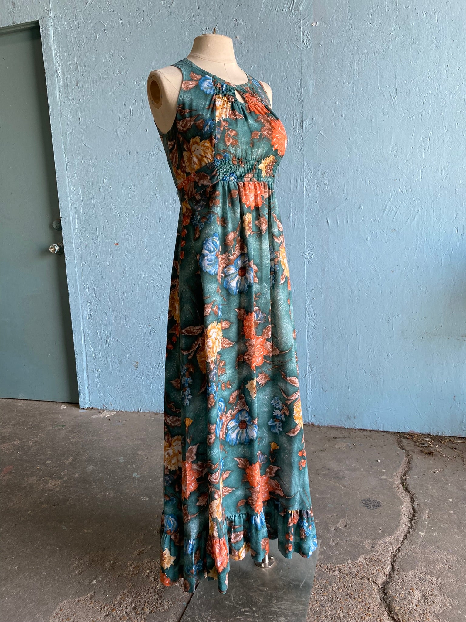 70's style maxi dresses 70's Dark green maxi dress with orange, blue and brown florals – Vida Antigua Collective