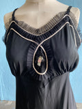 50-60's Black slip dress with silver and pink trim and embellishments