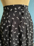 90's Black button down maxi skirt with a white polka dot & bow print