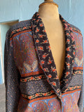 90's cropped jacket in a blocked patchwork Moroccan floral print.