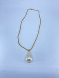 Long gold necklace with a single faux pearl drop.