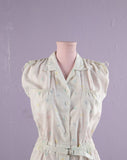 1980's White romper with pastel polka dots.