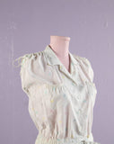 1980's White romper with pastel polka dots.