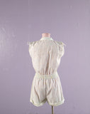 1980's White romper with pastel polka dots.