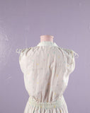 1980's White romper with pastel polka dots.