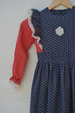 1970's Navy Blue & Red Prairie long sleeve apron dress with dainty white flowers