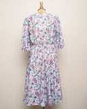 1970's Grey dress with pastel pink, violet & blue roses with a tie keyhole and puff sleeve