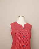 1970's Red & white polka dot sleeveless mod dress with navy trim & buttons with pockets