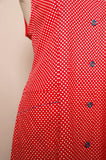 1970's Red & white polka dot sleeveless mod dress with navy trim & buttons with pockets