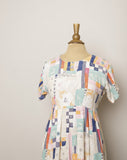 1990's Ivory baby doll dress with multi color abstract color block & sketch doodle print