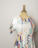 1990's Ivory baby doll dress with multi color abstract color block & sketch doodle print