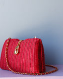 Red Wicker Purse w/gold chain shoulder strap.