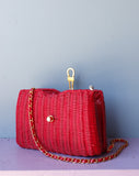 Red Wicker Purse w/gold chain shoulder strap.