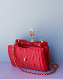 Red Wicker Purse w/gold chain shoulder strap.