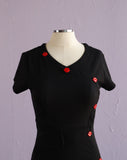 Y2K Black jersey knit body con dress with red lip side buttons
