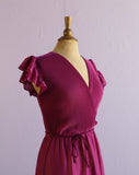 1970's Magenta dress with ruffle sleeves, elastic waistband, faux wrap bodice and asymmetrical ruffle hem.