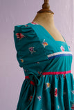 1990's Teal green floral house dress with adjustable side ties.