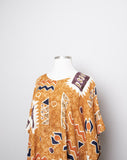 1990's Sandstone, Rust & ivory abstract printed mini caftan dress with a fringe hem