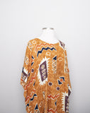 1990's Sandstone, Rust & ivory abstract printed mini caftan dress with a fringe hem