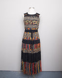 1990's Carole Little Black sleeveless dress with a striped abstract multi colored morrocan inspired print & back opening