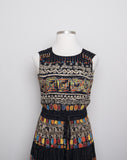 1990's Carole Little Black sleeveless dress with a striped abstract multi colored morrocan inspired print & back opening