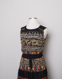 1990's Carole Little Black sleeveless dress with a striped abstract multi colored morrocan inspired print & back opening