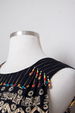 1990's Carole Little Black sleeveless dress with a striped abstract multi colored morrocan inspired print & back opening