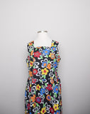 1990's Black sleeveless Plus Size dress with a primary colored flowers, back smocking & 1 pocket