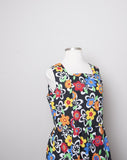 1990's Black sleeveless Plus Size dress with a primary colored flowers, back smocking & 1 pocket