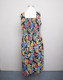 1990's Black sleeveless Plus Size dress with a primary colored flowers, back smocking & 1 pocket