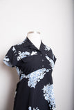 1990's Black Baby doll short sleeve mini dress with a sky blue grey floral bouquet print