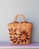 Straw Rattan tote bag embellished with a brown flowers