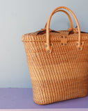 Straw Rattan tote bag embellished with a brown flowers