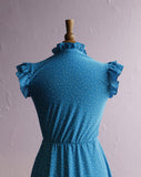 1970's Turquoise blue dress with white polka dots.
