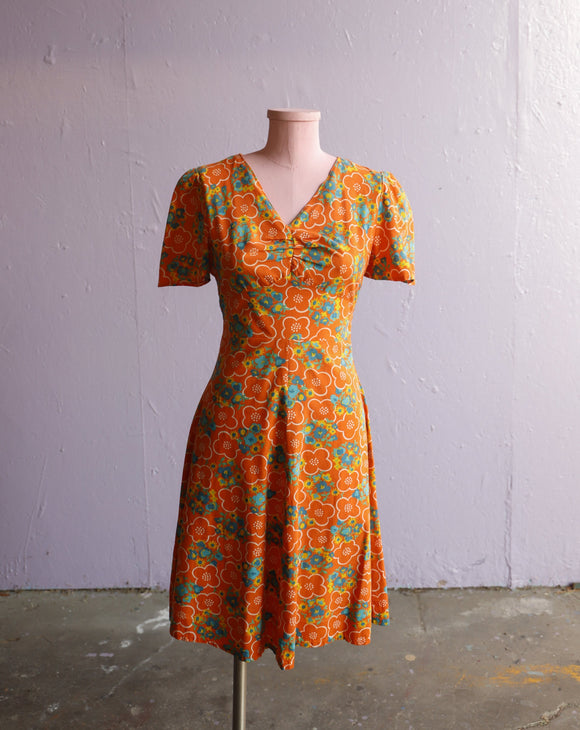 1970's Orange psychedelic floral mini dress.