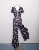 1970's Grey floral polyester wide leg jumpsuit with capelet sleeves
