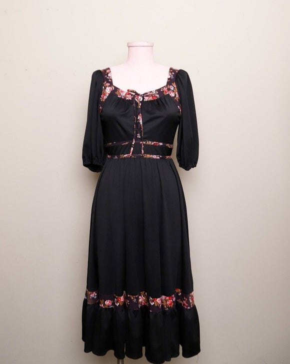 1970's Black prairie style puff sleeve dress with floral trim and corset lacing on bodice