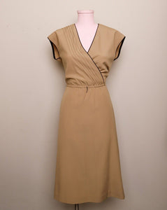 1970's Sleeveless Tan A-line dress with a faux wrap bodice and black trim detail