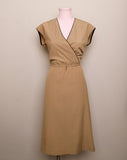 1970's Sleeveless Tan A-line dress with a faux wrap bodice and black trim detail