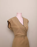 1970's Sleeveless Tan A-line dress with a faux wrap bodice and black trim detail