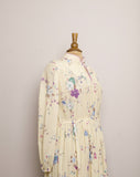 1970's Sheer Ivory accordion pleated long sleeve dress with purple & blue florals and mandarin collar key hole