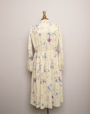 1970's Sheer Ivory accordion pleated long sleeve dress with purple & blue florals and mandarin collar key hole