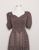 1970's Brown puff sleeve dress with a daisy print, sweetheart bust, princess seem and basque waist